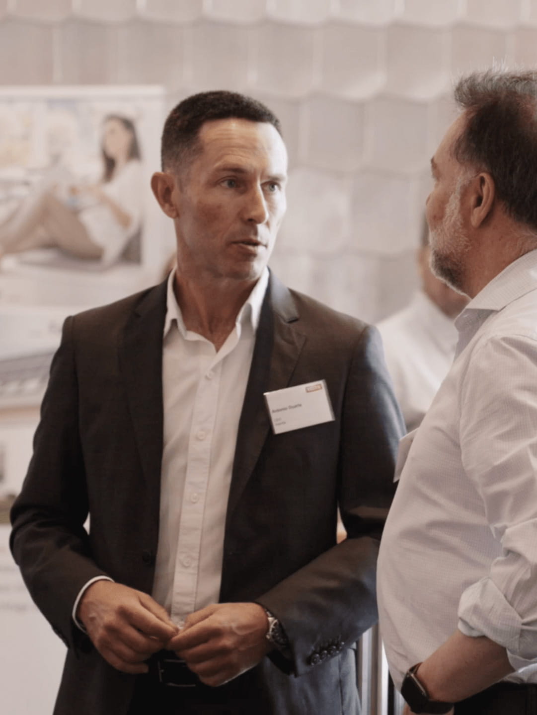 Two men talking together.